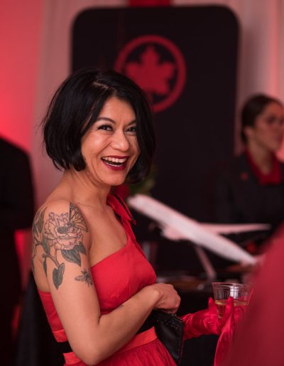 A guest enjoying themselves at The Red Dress Ball.